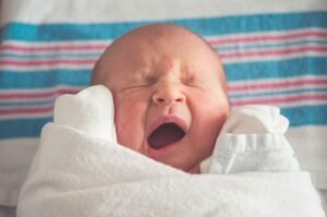 Putting oil in baby's soft spot