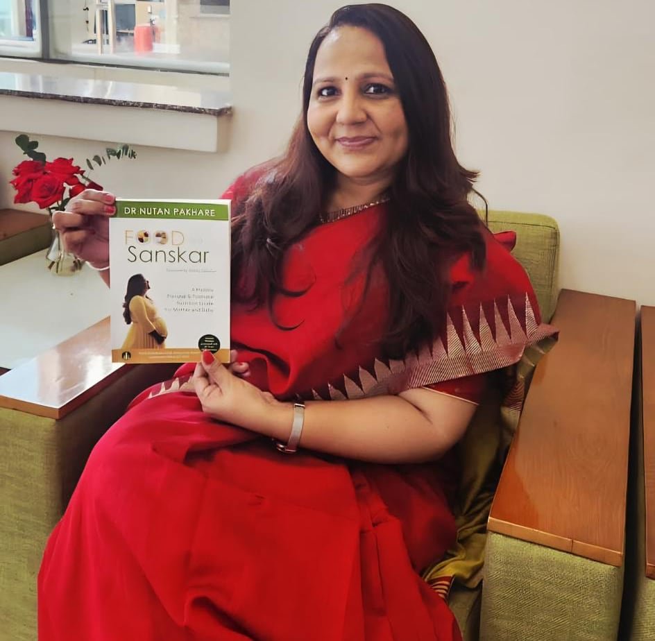 dr nutan pakhare with her book food as a sanskar